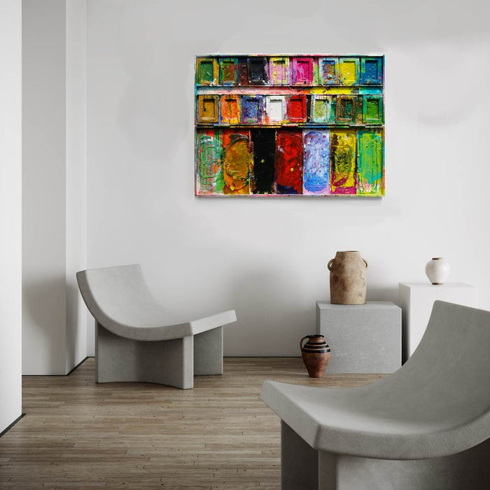 "Der Abschied" zeigt abstrakte Malerei auf einem großen Farbkasten (92 x 112 x 4 cm, in Situation). In den Mischfächer (unten) sind Gelb, Blau, Grün, Rot, Schwarz und Ocker zu sehen. Oben befinden sich 16 quadratische Teller mit den üblichen Farben einer Palette. In den Zwischenräumen sind Kleckse und Flecken sichtbar. Moderne Kunst vom Künstler Mark Hellbusch. ARTLET - Atelier Hellbusch